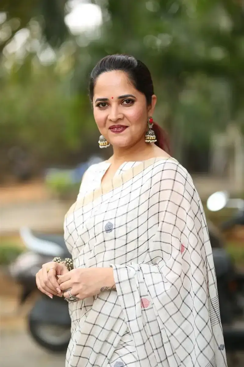 Anasuya Bharadwaj in White Saree at Razakar Movie Launch